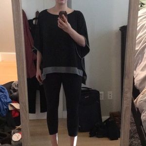 Dark grey poncho with light grey trim